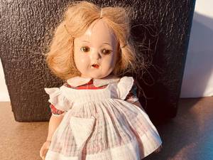 lot 134 image: Antique Doll and Suitcase with Doll Clothes
