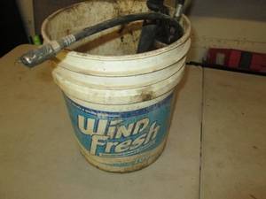 5 gallon bucket with 2 grease guns...