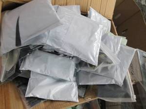 box of face masks and neck gaitors ...