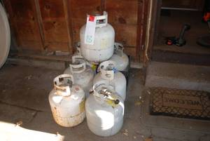 7 propane tanks, 1 feels half full ...