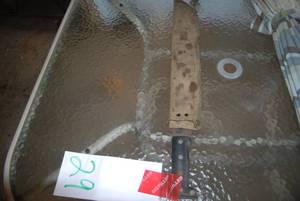 Jungle machete with worn canvas cas...