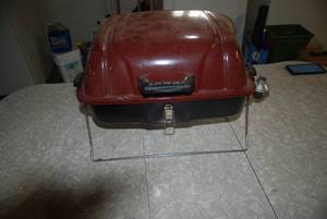 Propane camping grill with locking ...