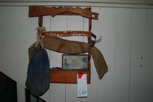 Wooden wall gun rack with old rifle...