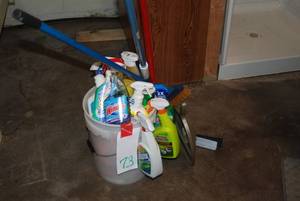5 gallon pail full of cleaning supp...