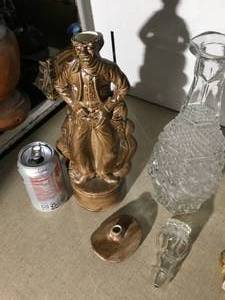 2 decanters and one glass decanter has a chip in the topper