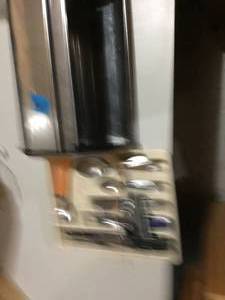 misc kitchen silverware and knife and bread box