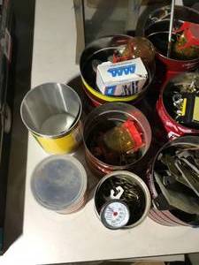 7 coffee containers of garage items and bird house