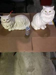 2 ceramic cats one has an ear repaired.