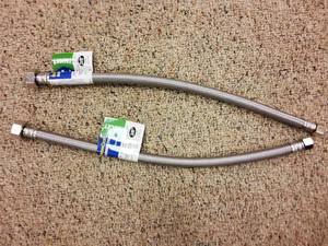lot 39 image: 2 in toilet replacement kit and (2) 12 in x 16 in braided hoses