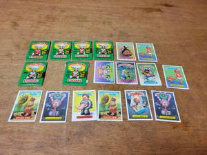 lot 289 image: Lot of Original Garbage Pail Kids Cards - (5) Sealed Packs w Original Gum From 1986, (1) Open Pack and (12) Single Cards from 1988