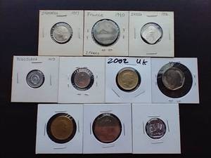lot 63 image: 10 Foreign Coins in 2X2 Sleeves