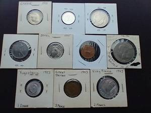 lot 92 image: 10 Foreign Coins in 2X2 Sleeves