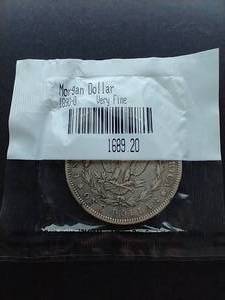 lot 101 image: 1890-O Morgan Dollar