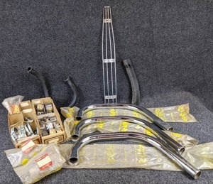 lot 1540 image: Large Lot of Vintage Suzuki Exhaust Pipe Clamps and Parts