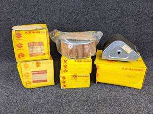 lot 1530 image: NOS - (Lot of 7) Vintage Suzuki Motorcycle Air Filters - Part No. 13781-29610, 64210-31001, 00041-01536, 00041-01570, 13780-29601, 13780-16511 and 13780-26010