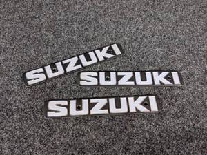 lot 1558 image: NOS - (Lot of 3)  Vintage Metal SUZUKI Emblems - Measure about 7-18 x 1-316 Each