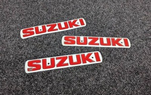 lot 1559 image: NOS - (Lot of 3)  Vintage Metal SUZUKI Emblems, Part No. 68111-97200 - Measure about 7-18 x 1-316 Each