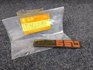 lot 1560 image: NOS - GS550 Plastic Emblem, Part No. 68141-47010, Measures about 4-34 x 78