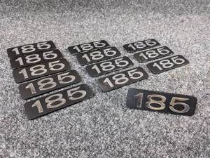 lot 1563 image: NOS - (Lot of 13) Vintage 185 Metal Emblems - Measure about 3-316 x 1