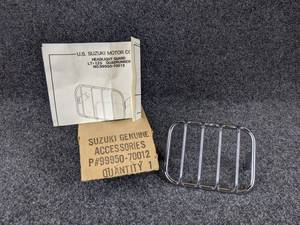 lot 1546 image: NOS - LT125 Quadrunner Headlight Guard - Part No. 99950-70012