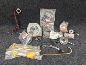 lot 1587 image: NOS - (Lot of 4) 1968 Suzuki 80K10 Bracket, Part No. 14470-01201 and More