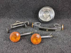 lot 1593 image: USED - Lot of 80s Suzuki Parts - Headlamp, Turn Signals and More