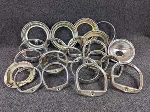 lot 1595 image: Large Lot of Vintage Suzuki Headlamp Brackets and Bezels