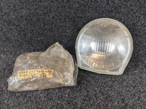 lot 1648 image: NOS - 1968 Suzuki B100P, B105P, KT120  Headlamp Lens Assembly - Part No. 35121-07610