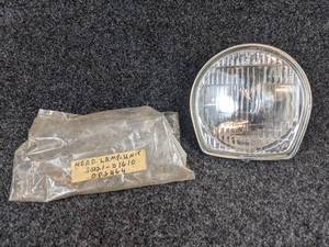 lot 1647 image: NOS - 1968 Suzuki 50, M15, M15D, M12 Headlamp Lens Assembly - Part No. 35121-01610