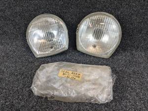 lot 1646 image: NOS - (Lot of 2) 1969 Suzuki A100, AS100, AC100 Head Lamp Unit - Part No. 35121-07690