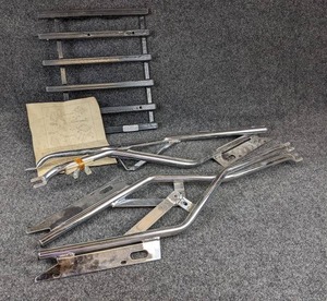 lot 1650 image: NOS - Larco Luggage Rack Arms and Rack Top - Includes (2) Sets of Arms and (1) Rack To