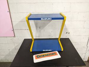 lot 1502 image: Vintage Metal Suzuki Store Shelf Display w Suzuki Generators Sign - NO SHIPPING