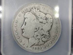 lot 10 image: 1889 O Morgan Silver Dollar, NCS Bi...