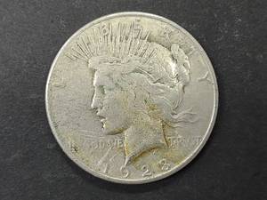 lot 32 image: 1923 S Peace Silver Dollar...