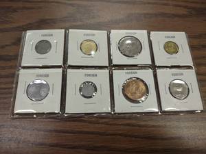 lot 108 image: (8) Foreign Coins...