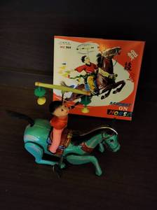 lot 76 image: Vintage Chinese Acrobat on Horse Toy