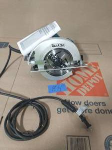 lot 24 image: MAKITA 7-14 in. 15 Amp Corded Circular Saw