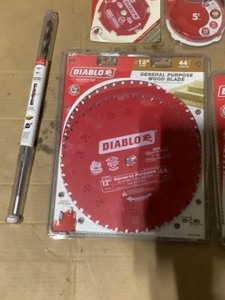 lot 28 image: Diablo 12 in. 44-Tooth 2-Pack General Purpose Blades, 12 in. 80-Tooth Fine Finish Blade, 12 in. x 18 in. Installer Drill Bit & Disc Sand Paper. See Pictures