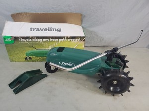 lot 27 image: New Orbit Traveling Lawn Sprinkler - Wheel Issue