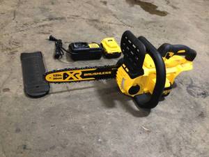 lot 4 image: 12 in. 20V MAX Lithium-Ion Cordless Brushless Chainsaw with (1) 5.0Ah Battery and Charger Included by DEWALT Customer Returns See Pictures