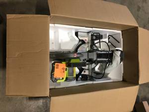 lot 9 image: 15 Amp 10 in. Sliding Compound Miter Saw with LED by RYOBI Customer Returns See Pictures