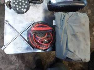 lot 17 image: Car Cover, Set Of Jumper Cables, Tire Iron