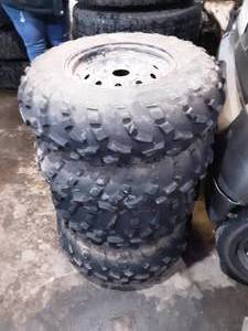 lot 22 image: Set Of 4-Stock Wheels & Tires From 2020 Suzuki King Quad 750. 4x110 Lug Pattern. 2-Tires