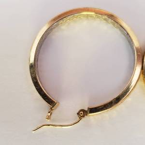 lot 61 image: Pair Of 1 Inch Gold Tone Hoops Stamped 14K