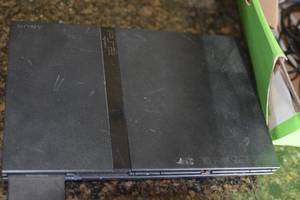 lot 19 image: PS2 with controllers