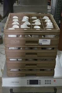 lot 30 image: roughly 70 coffee cups Mayer china and dishwasher racks