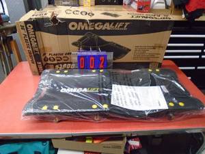 New Omega lift plastic creeper. New in box. Was a store display. As shown.