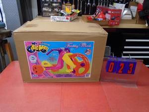 Fantasy wheel big wheel riding toy. New in box. As shown.