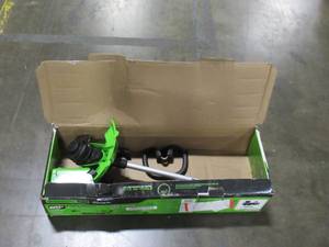lot 333 image: Greenworks PRO 60V Cordless Brushless Cordless String TrimmerLeaf Blower Combo Kit (Trimmer only, Blower Missing, Not Tested) Model STBA60B412
