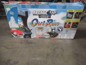 lot 430 image: Arcade1Up Outrun 4 Games in 1 - Stand-up Arcade with Riser and Lit Marquee - Damaged Side Walls - All other carton in box look to be in nice condition.